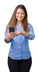 Fototapeta premium Young beautiful brunette business woman using smartphone over isolated background with a happy face standing and smiling with a confident smile showing teeth