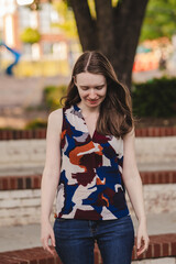 Portrait of a woman looking down and walking