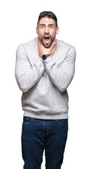 Fototapeta premium Young handsome man wearing sweatshirt over isolated background shouting and suffocate because painful strangle. Health problem. Asphyxiate and suicide concept.