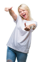 Young beautiful blonde woman wearing white t-shirt over isolated background approving doing positive gesture with hand, thumbs up smiling and happy for success. Looking at the camera, winner gesture.