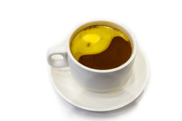 Simple cup of healthy black espresso coffee with added butter for taste and energy, suitable as ketogenic diet.
