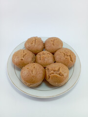 Kue Apem: Indonesian Steamed Sweet Dessert with White Brown Sugar or White Sugar, Showcasing Traditional Culinary Heritage on a Clean White Background