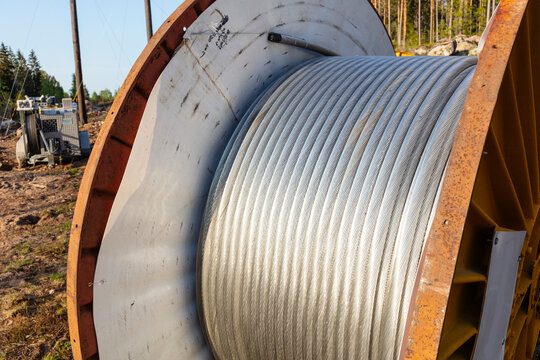 Gray cable drums at construction site