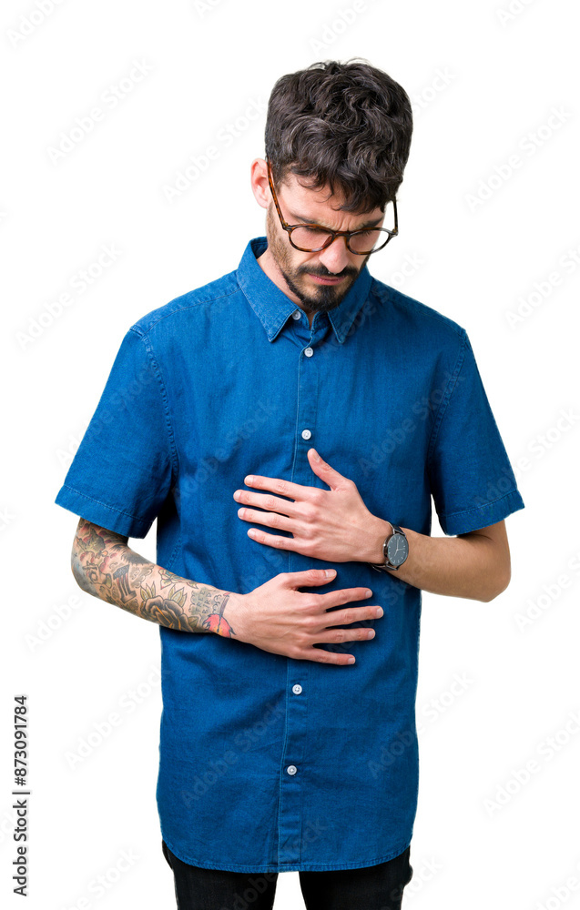 Poster Young handsome man wearing glasses over isolated background with hand on stomach because nausea, painful disease feeling unwell. Ache concept.