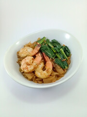 Kwe Tiau with Assorted Toppings: Stir-Fried Rice Noodles Loaded with Fresh Veggies, Eggs, and Succulent Shrimps, Expertly Presented on a Clean White Background, Perfect for Exploring Southeast Asia