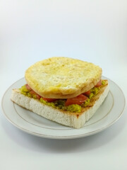 Mashed Avocado, Diced Tomato, Omelette, on Toast: Flavorful and Colorful Breakfast Combination Featuring Fresh Ingredients, Perfectly Presented on a Clean White Background