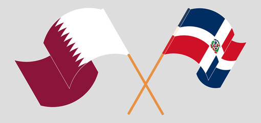 Crossed and waving flags of Qatar and Dominican Republic