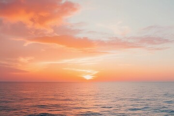 Dreamy sunrise over the ocean with a vibrant, fiery orange gradient, creating serene and ethereal moments perfect for tranquility