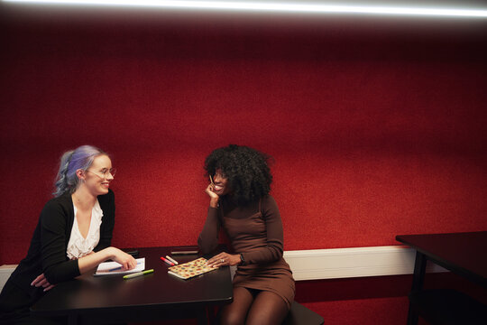 Young businesswoman sitting over table while working in office