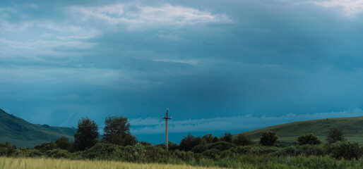 Storm clouds hang on the mountains.