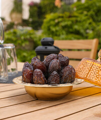 plate of fresh dates on a wooden table