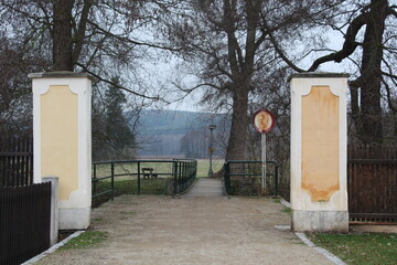 Old abandoned bridge to a meadow