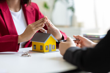 Real estate agents provide home insurance advice and signing home sales contracts to clients.