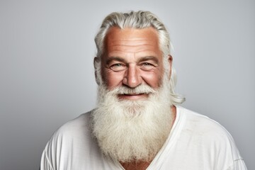 Obraz premium Smiling bearded mature man portrait against white background