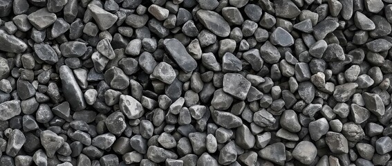 A close-up texture of various sized grey pebbles, creating a natural and earthy background. Perfect for nature, background, and texture themes.