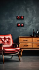 a red chair and a table with a bottle of wine on it