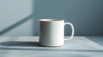 Fototapeta premium Minimalist Ceramic Mug on Soft Gray Surface, Side View, Flat Lay. Emphasize the clean lines and minimalist design, capturing the essence of contemporary tableware.