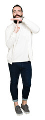 Young hipster man with long hair and beard wearing sporty sweatshirt Doing time out gesture with hands, frustrated and serious face
