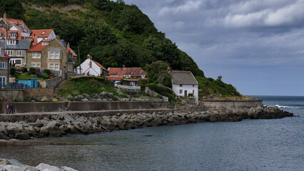 Runswick Bay is a picture postcard North Yorkshire coastal village, boasting a mile of secluded bay and gorgeous beach. Situated nine miles north of Whitby, it nestles in between Sandsend and Staithes