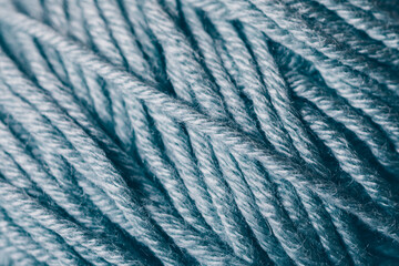A close up of a blue yarn with a fuzzy texture