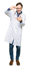 Handsome middle age doctor man wearing medical coat smiling making frame with hands and fingers with happy face. Creativity and photography concept.