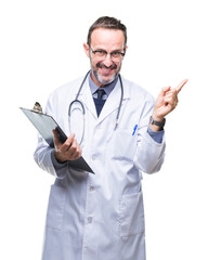 Middle age senior hoary doctor man holding clipboard over isolated background very happy pointing with hand and finger to the side