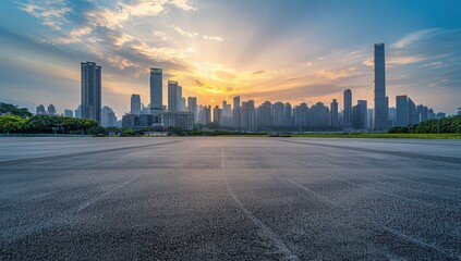 Sunny day, wide angle of the city skyline with modern buildings and empty asphalt floor with tire marks under blue sky.