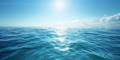 Fototapeta premium Beautiful Ocean View with Clear Blue Sky, Wide Shot of Sea Surface with Gentle Ripples and Sparkling Water Under Bright Sunlight, Creating an Enchanting Scene for Endless Adventure