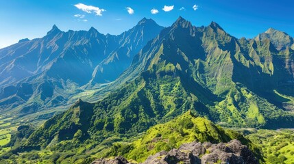 A breathtaking view of a mountain range with sharp peaks and lush green valleys, under a clear, blue sky.