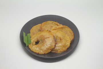 Kue cucur is a traditional Indonesian snack made from rice flour and brown sugar and then fried.soft focus and shiny texture
