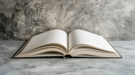 Book open on table with gray background and empty space