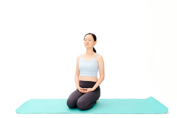 Fototapeta premium Beauty doing yoga with a white background