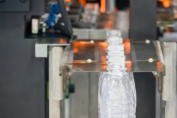 The  empty drinking water bottles  on the conveyor belt for filling process.