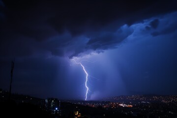 Striking photograph of lightning in a night sky, illuminating the horizon and cityscape, capturing the raw power and beauty of a thunderstorm and urban landscape.