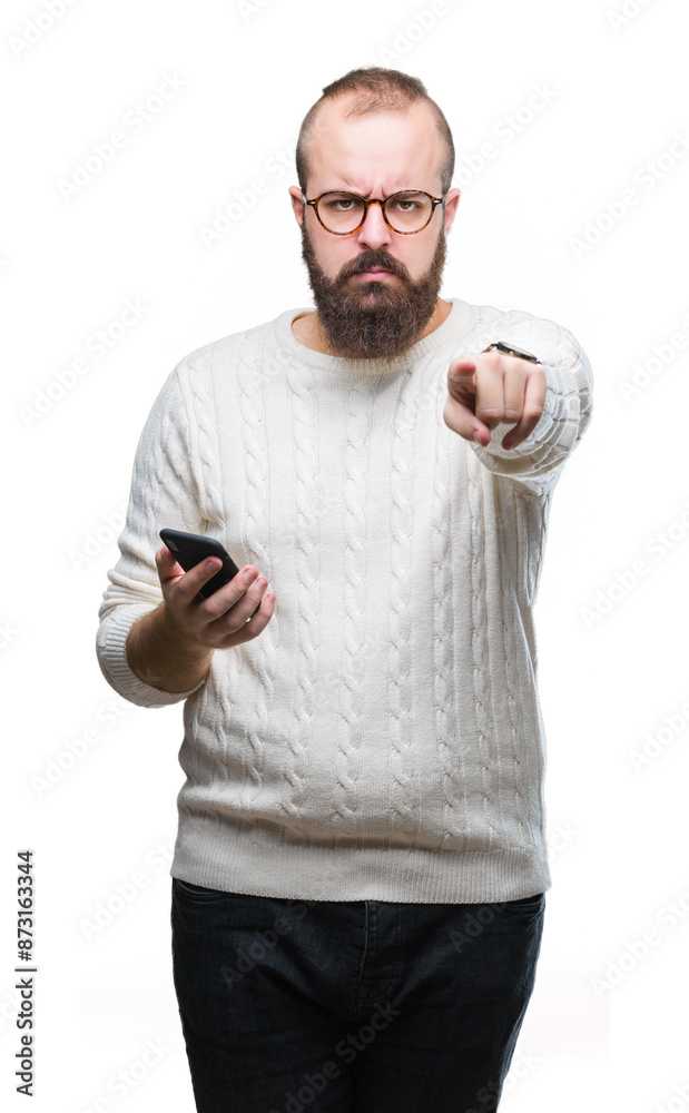 Poster Young caucasian hipster man texting sending message using smartphone over isolated background pointing with finger to the camera and to you, hand sign, positive and confident gesture from the front