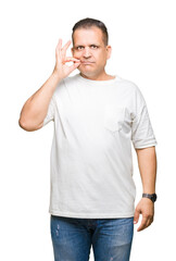 Middle age arab man wearig white t-shirt over isolated background mouth and lips shut as zip with...