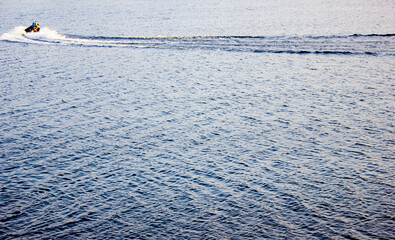 Jet ski, high-speed water transportation. Jet ski on the river, water body.