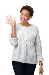 Beautiful young african american woman wearing sweater over isolated background showing and pointing up with fingers number five while smiling confident and happy.