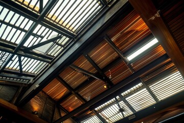 Interior of a modern building with wooden ceiling and glass roof.