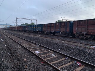 Fototapeta premium Transport cargo logistics train on the railway track
