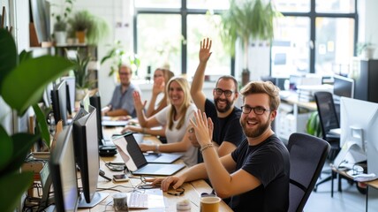 Professional business people smiling to camera while raising hands and wearing causal cloth. Group of multicultural marketing team looking at camera while standing at creative modern office. AIG53F.