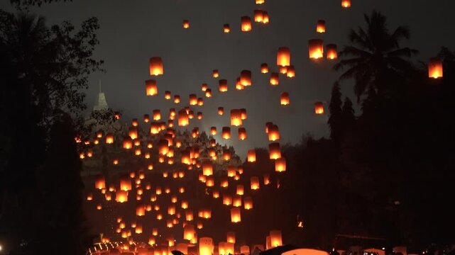 Indonesian people gathering together to release lantern during buddhism Vaisak Day celebration at Borobudur Temple.