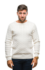 Fototapeta premium Young handsome man wearing winter sweater over isolated background depressed and worry for distress, crying angry and afraid. Sad expression.