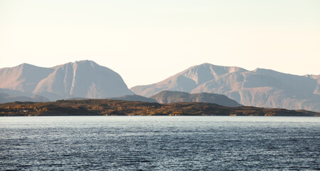 Coastal mountains, natural panoramic photo. Norwegian landscape