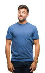 Fototapeta premium Young handsome man over isolated background smiling looking side and staring away thinking.