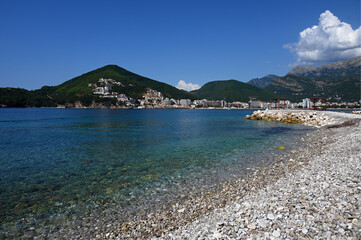 Hawaii beach, Sveti Nikola Island, Island of Saint Nicholas, Budva municipality, Montenegro, Europe - iddylic beach on island with view for historic and modern parts of Budva city