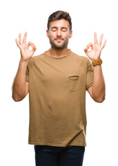 Young handsome man over isolated background relax and smiling with eyes closed doing meditation gesture with fingers. Yoga concept.