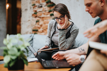Young business entrepreneurs having an outdoor meeting with a laptop and discussing ideas. Collaborative environment fostering creativity and innovation.