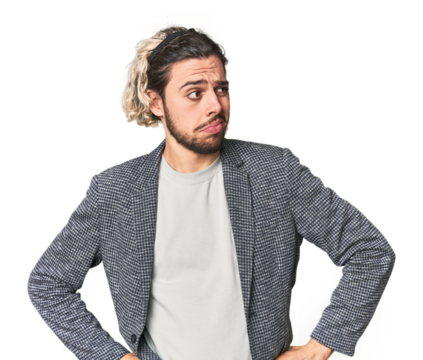 Young businessman in casual blazer confused, feels doubtful and unsure.