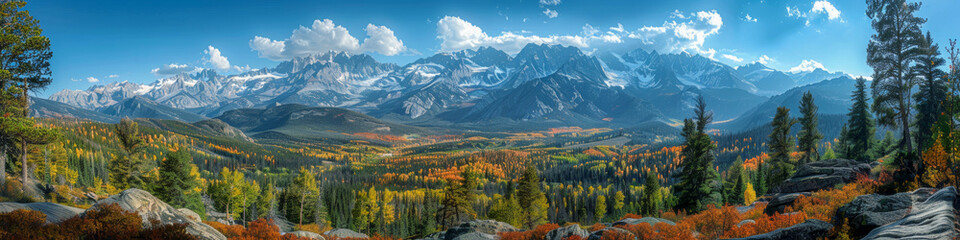 Fototapeta premium Stunning Panoramic View of Vibrant Autumn Landscapes and Snow Capped Mountain Range